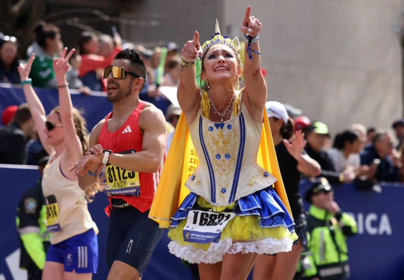  Boston Marathon 2025 runner celebrates in princess costume at finish line, Image Credits The Boston Globe