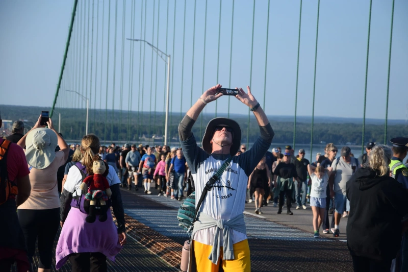 Participant photographs the crowd during Mackinac Bridge Walk, Image Credits: Mackinac Bridge Authority