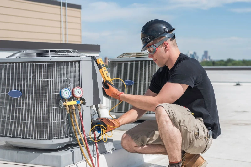 Technician with gauges and tester checking refrigerant in rooftop AC unit - what Refrigerant