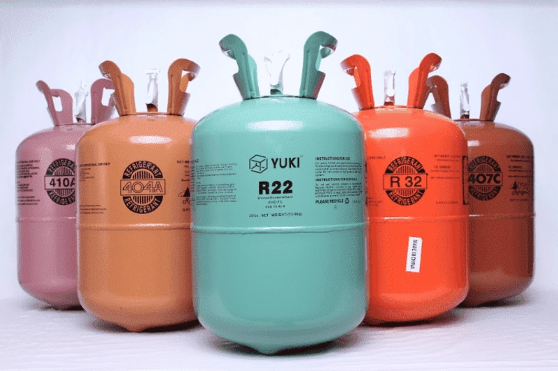 Assortment of AC refrigerant cylinders labeled R22, R32, R404A, R407C, and R410A. - what refrigerant
