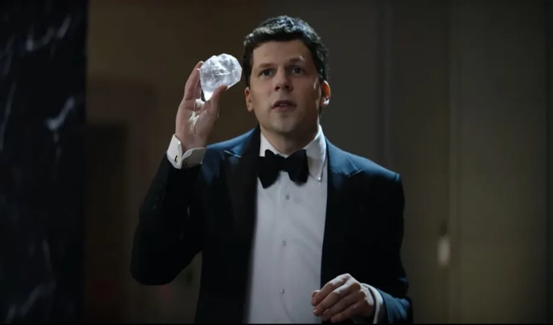 Jesse Eisenberg as J. Daniel Atlas in a tuxedo, holding crystal illusion prop, from Now You See Me 3. Image Credits: Lionsgate