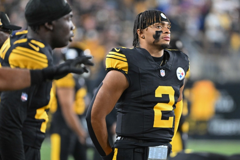 Justin Fields in Pittsburgh Steelers uniform, focused on sideline, Barry Reeger-Imagn Images.