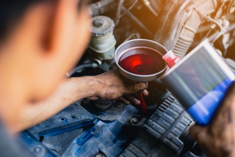 how to check transmission fluid - pour and funnel