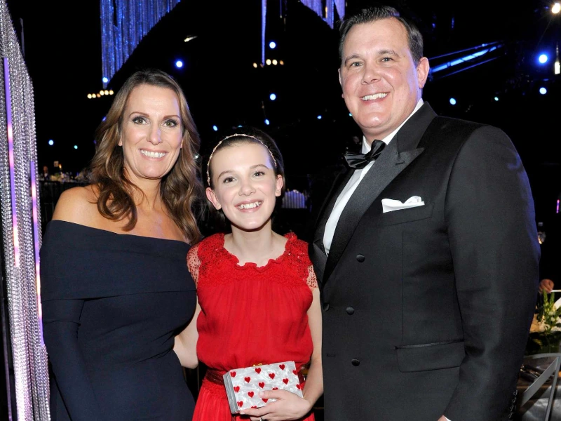 Millie Bobby Brown with her parents, formal event, Image Credits John Sciulli/Getty