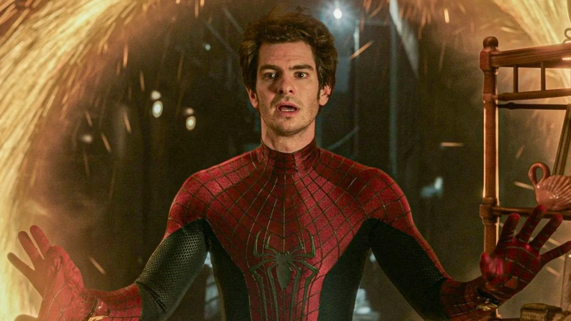 Spider-Man in iconic red suit, webs raised, fiery sparks background, Netflix. Image credits: Andrew Garfield / Netflix