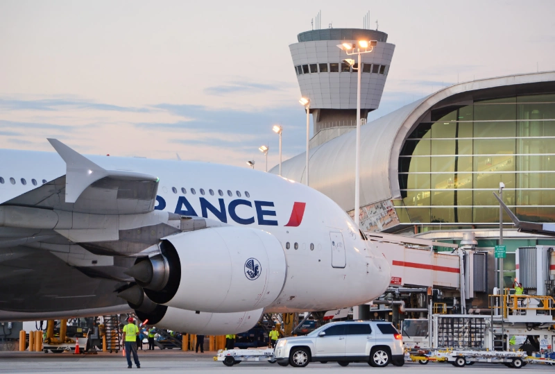MIA Airport terminal exterior view with airplanes, image credits: Miami International Airport