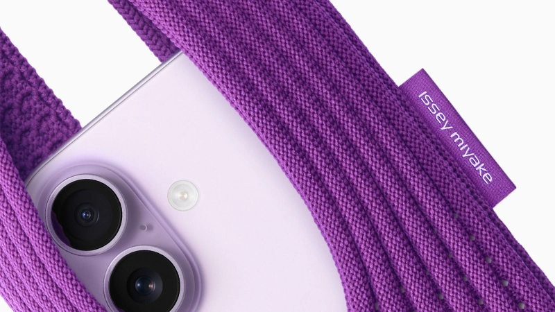 Purple Issey Miyake knit case partially covering a white iPhone dual-camera. Image Credits - Apple