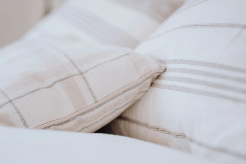 Close-up of cozy, soft patterned bamboo pillows. Image credits: Bailey Alexander / UNSPLASH