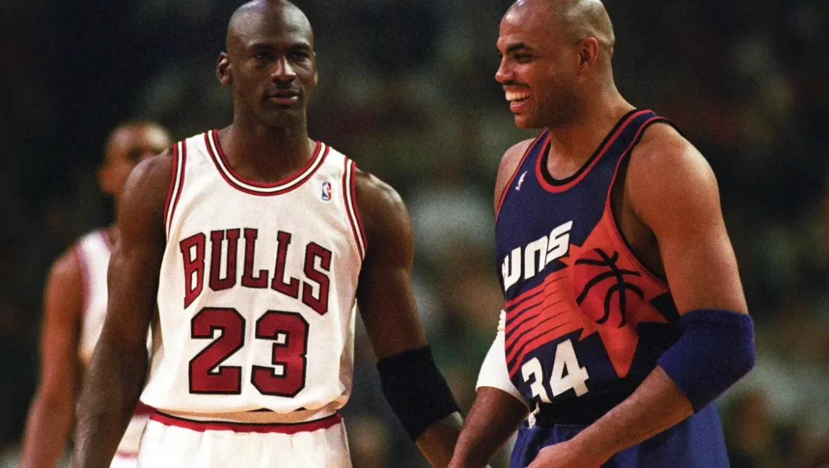 Charles Barkley in a Suns jersey and Michael Jordan in a Bulls jersey during an NBA game. Credit: Rob Schumacher/The Republic related to Charles Barkley.