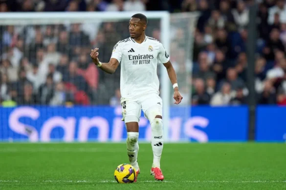 David Alaba soccer player in Real Madrid jersey with number 21, in motion on the field during a match.