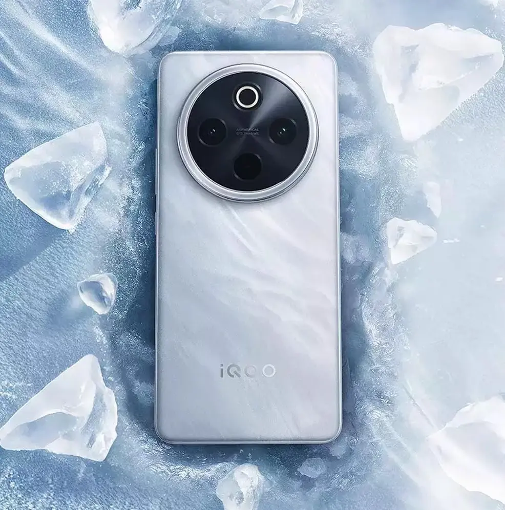 iQOO Z10 and Z10x - Smartphone with a metallic back, circular camera module with three lenses and an LED flash, placed on an icy surface with ice shards around it.