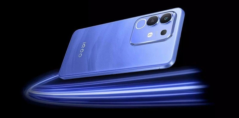 "Blue iQOO Z10 and Z10x smartphone with three camera lenses and a flash, positioned at an angle against a black background with a blue light trail effect.