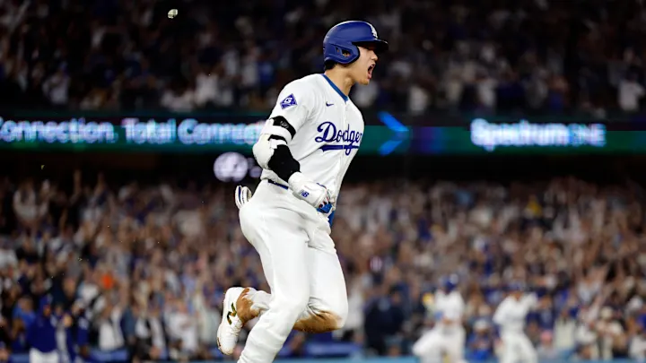 Dodgers player celebrating mid-air, highlighting the phillies score.