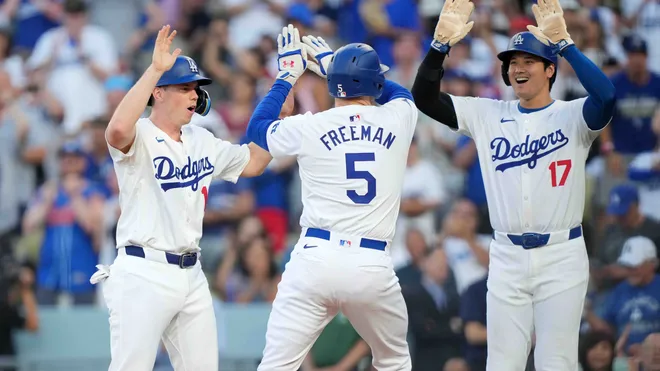 Dodgers players celebrating on the field, highlighting the phillies score.