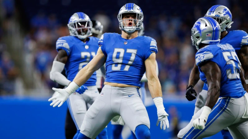 Lions Schedule 2025: Aidan Hutchinson celebrates with teammates during NFL game.