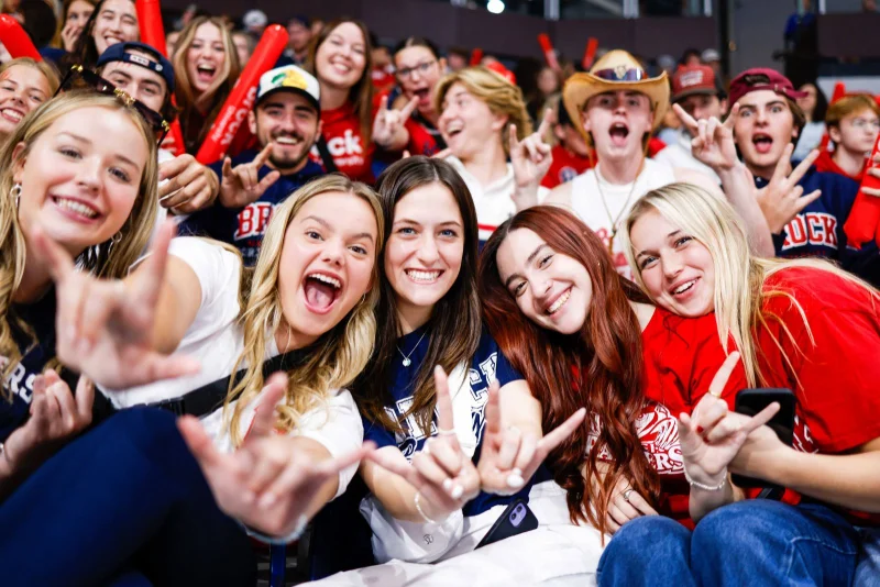 What is homecoming: Brock University students cheering at Steel Blade Classic hockey game.