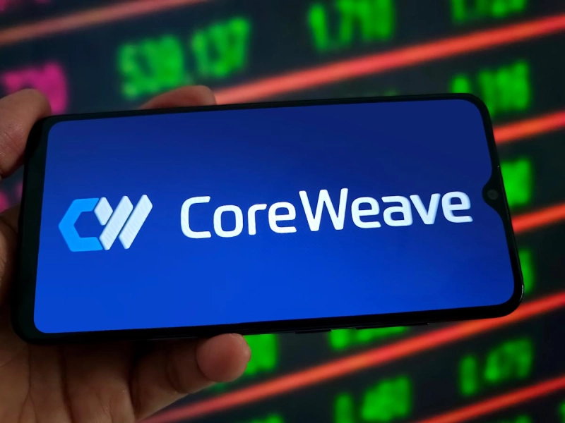CoreWeave: logo on phone with stock market display.
