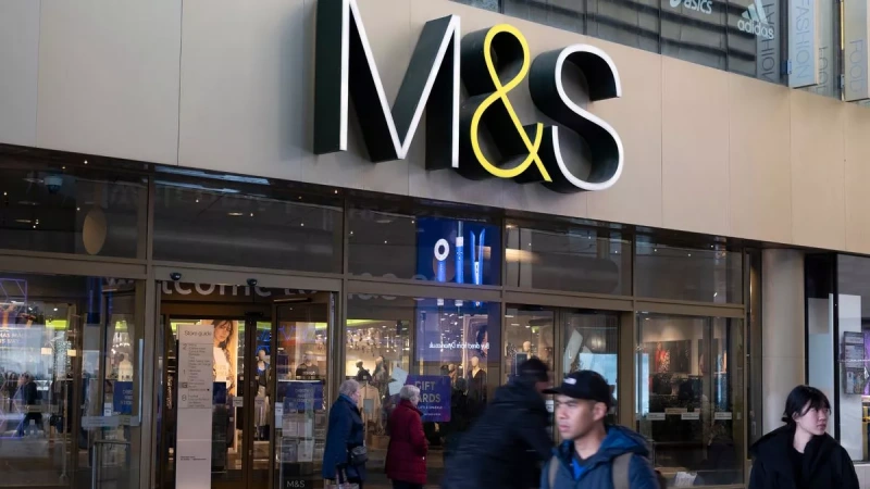 m&s cyber attack: M&S storefront with shoppers after cyber breach.