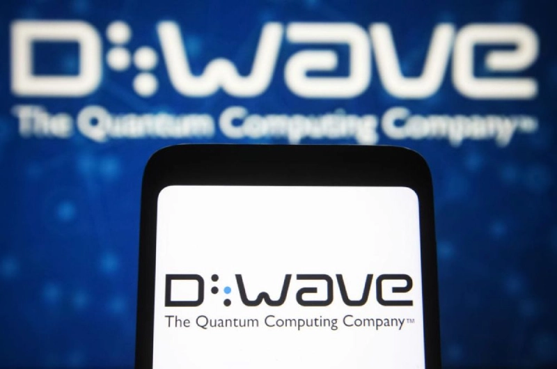 QBTS stock: D-Wave Quantum logo on phone and screen.