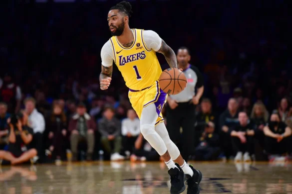 D'Angelo Russell, Lakers #1, dribbling basketball in NBA game action.