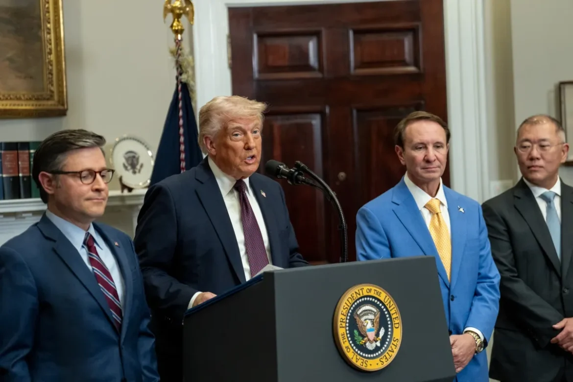 Jeff Landry in blue suit stands beside president at White House podium, Image Credits: (White House)