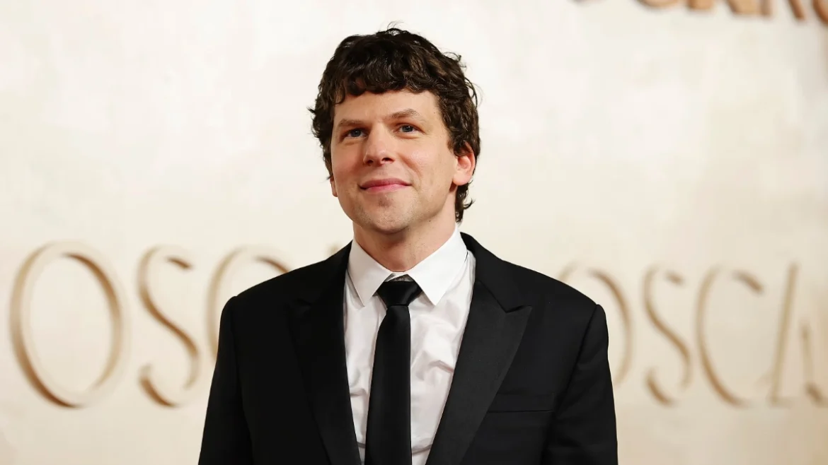 Jesse Eisenberg in black tuxedo at Oscars event, Image Credits - Getty Images