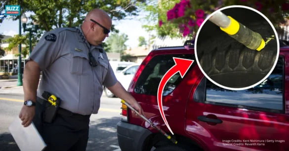 What does chalk on tires do - officer marking tire for parking enforcement, credits Kent Nishimura | Getty Images