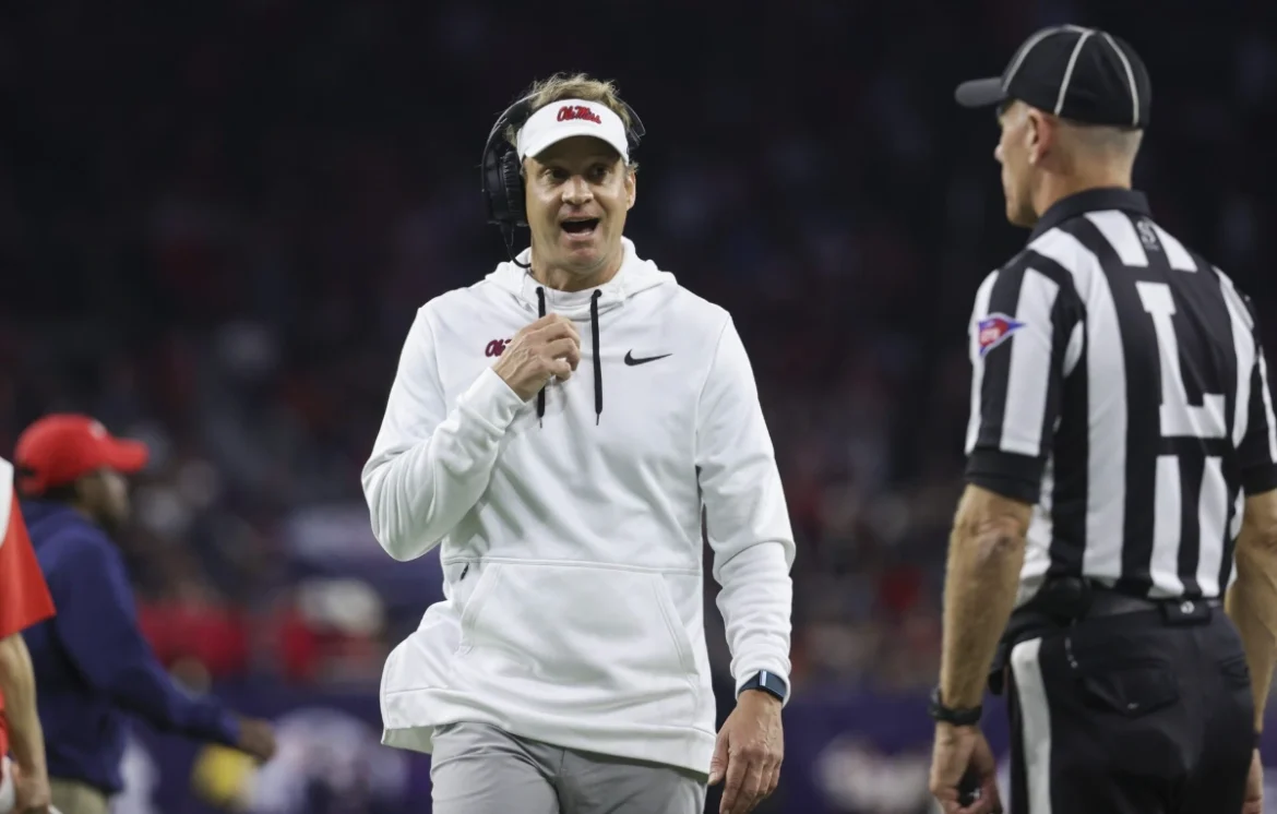 Lane Kiffin on the sideline talking to a referee. Image Credits: Lane Kiffin