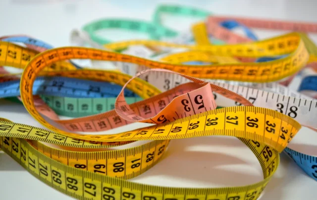 A ruler with inches on one edge and centimetres on the other