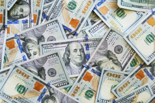 US dollar banknotes spread out together