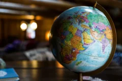 A world map with pins marking different countries